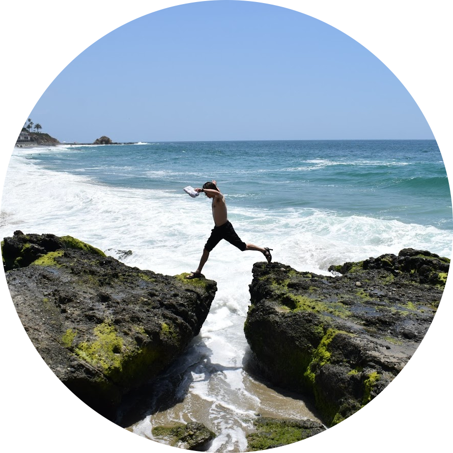 man jumping over rocks